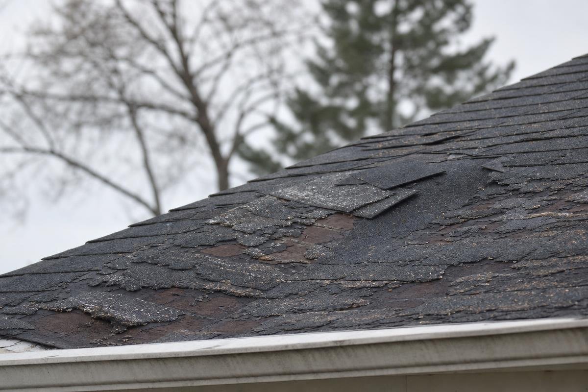 roofing contractor Greenville SC inspecting ice storm roof damage