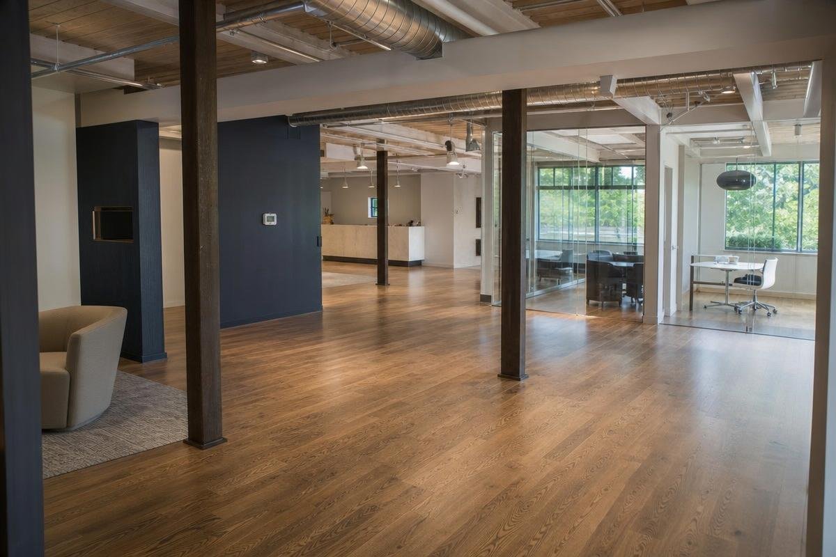 worn commercial flooring in a Raleigh, NC retail space needing replacement